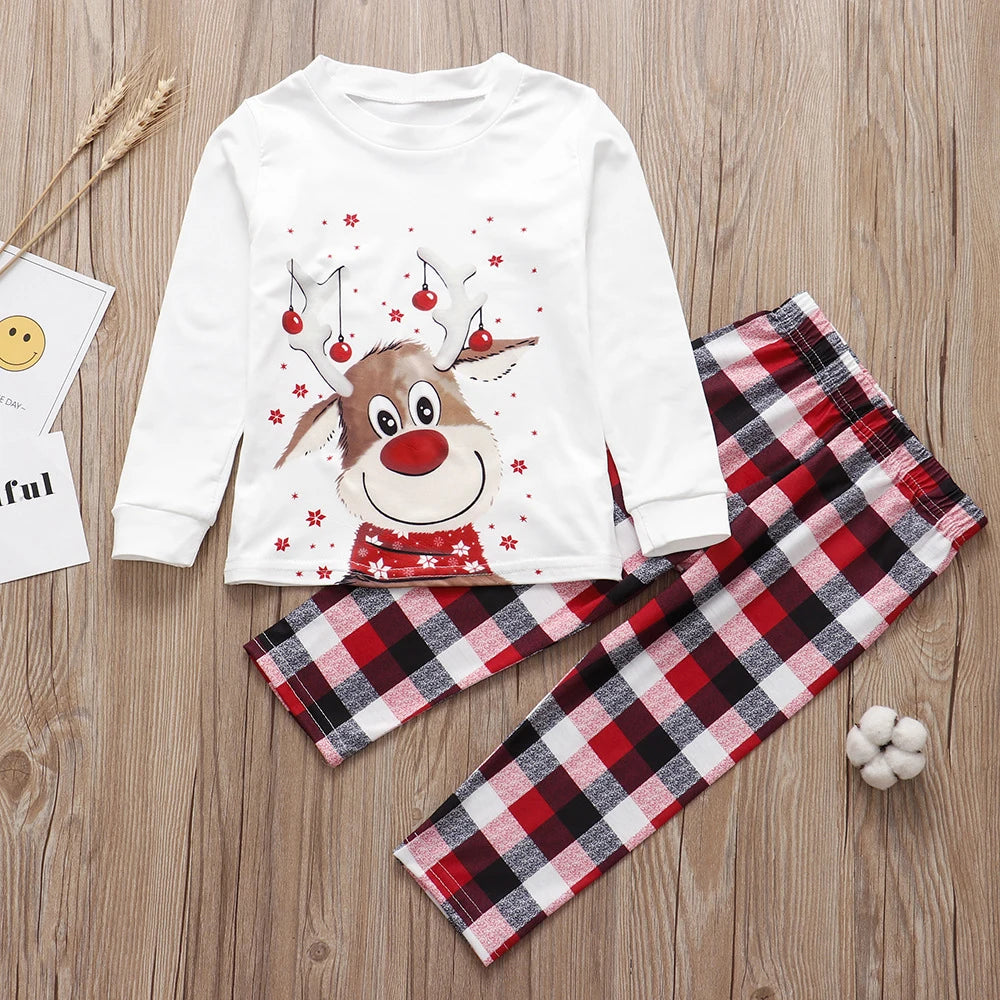 Close-up of SnugglePJs red and white Christmas pyjamas fabric pattern