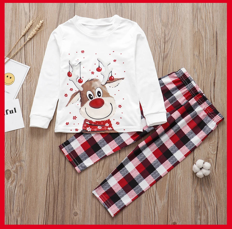 SnugglePJs laid-out flat – matching Christmas PJs set with accessories