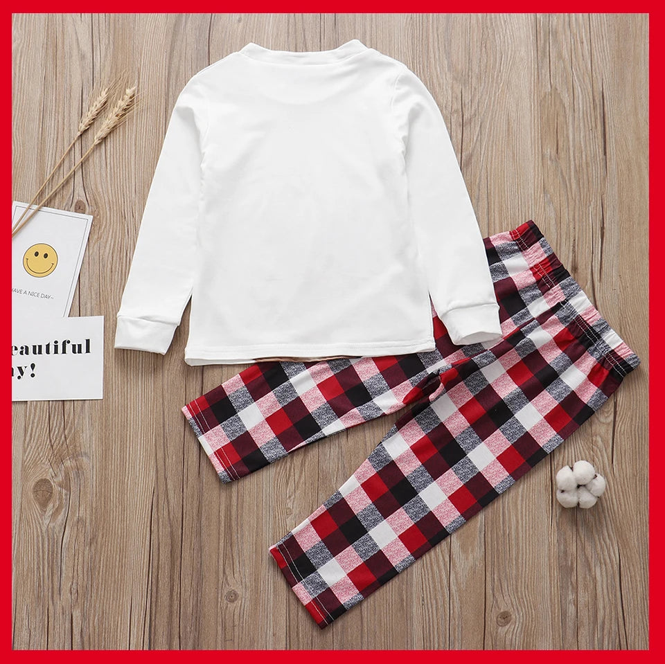 SnugglePJs laid-out flat back side– matching Christmas PJs set