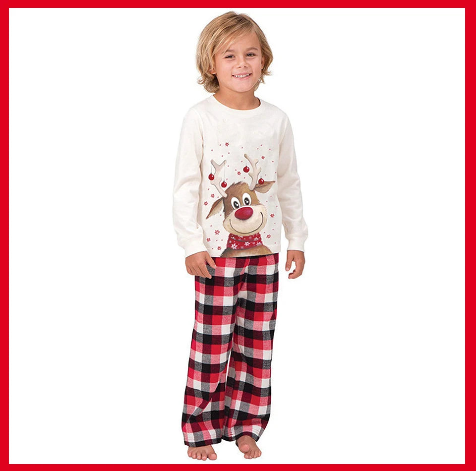 SnugglePJs matching Christmas PJs – Kid wearing Christmas Pijamas